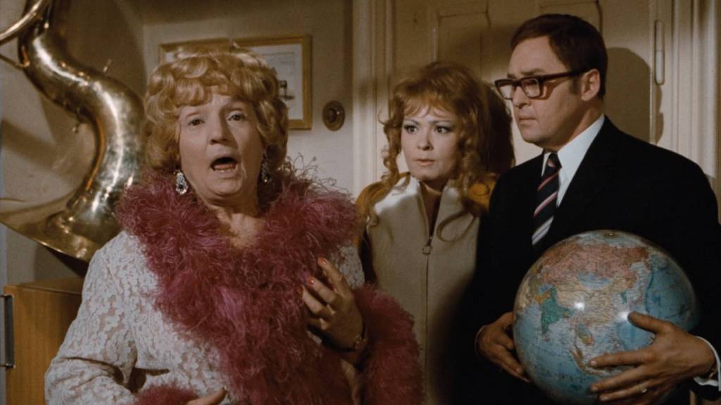 Lubomir Lipsky's George Camel in trouble with his nagging landlady again in Four Murders Are Enough, Darling