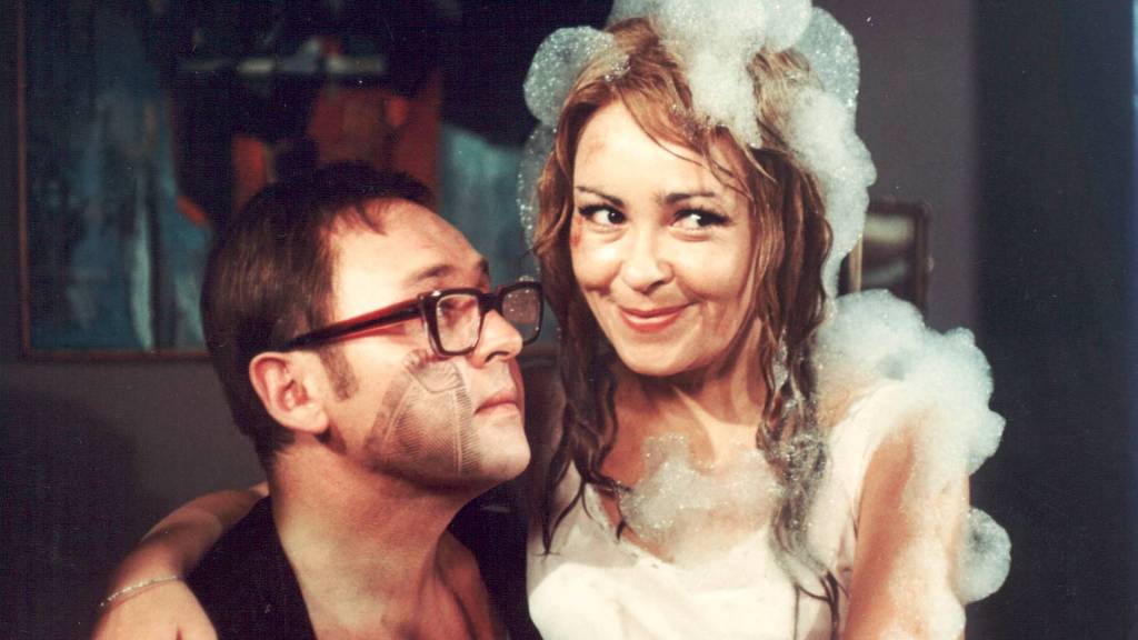 Lubomir Lipsky's hapless Georg Camel gazes at his love interest Sabrina, covered in soap suds, in Four Murders Are Enough, Darling